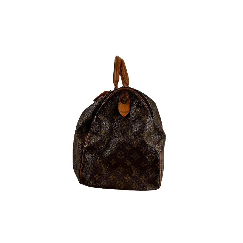 Louis Vuitton Twist bags with a snakeskin - effect panel for a bold lookLouis Vuitton Keepall 45 in Monogram Canvas