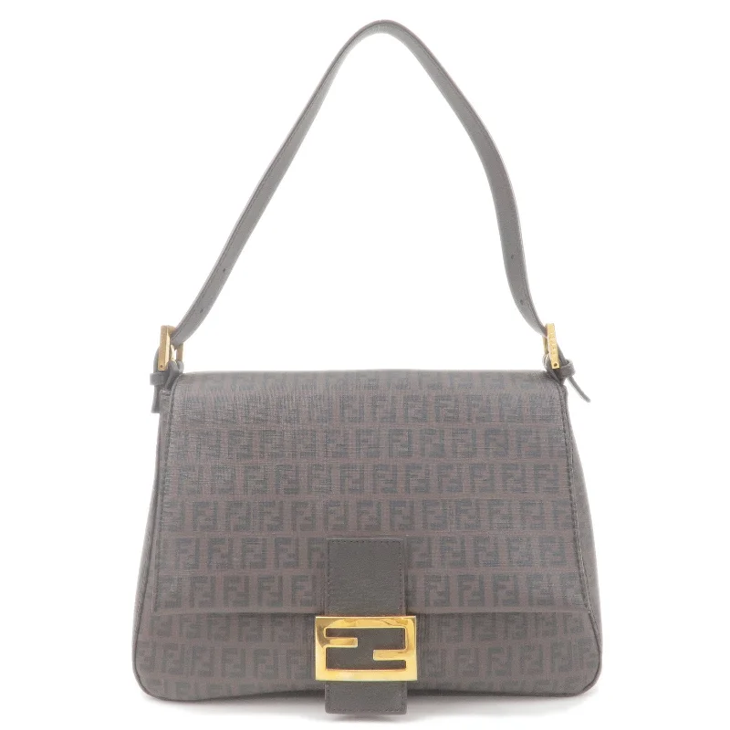 Fendi Baguette bags with a detachable charm featuring the brand's mascotFENDI Mamma Baguette Zucchino PVC Leather Hand Bag Brown 8BR001