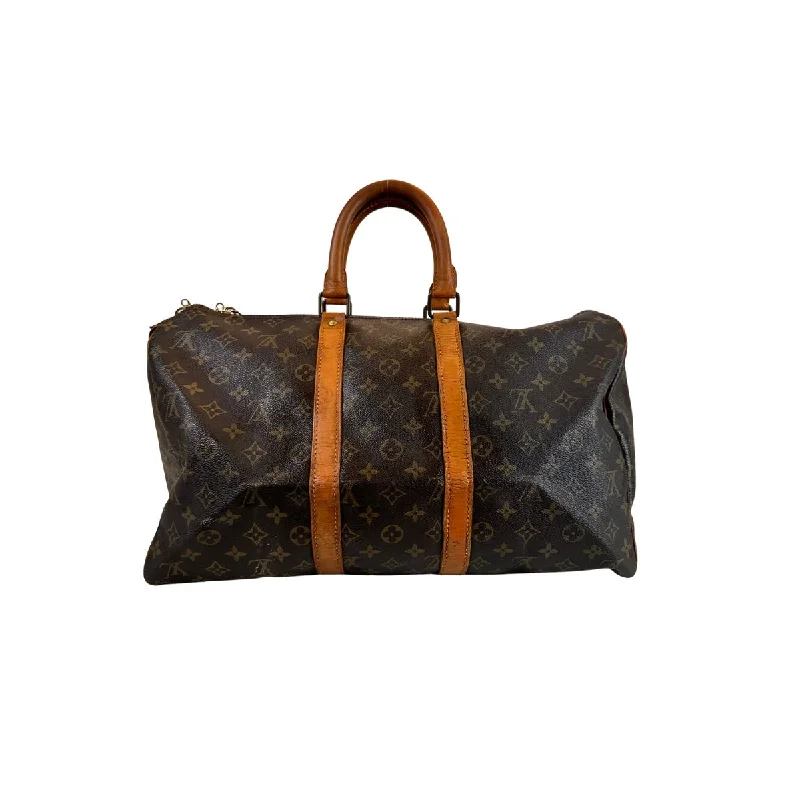 Louis Vuitton Alma bags featuring the signature top - handle designLouis Vuitton Keepall 50 in Monogram Canvas