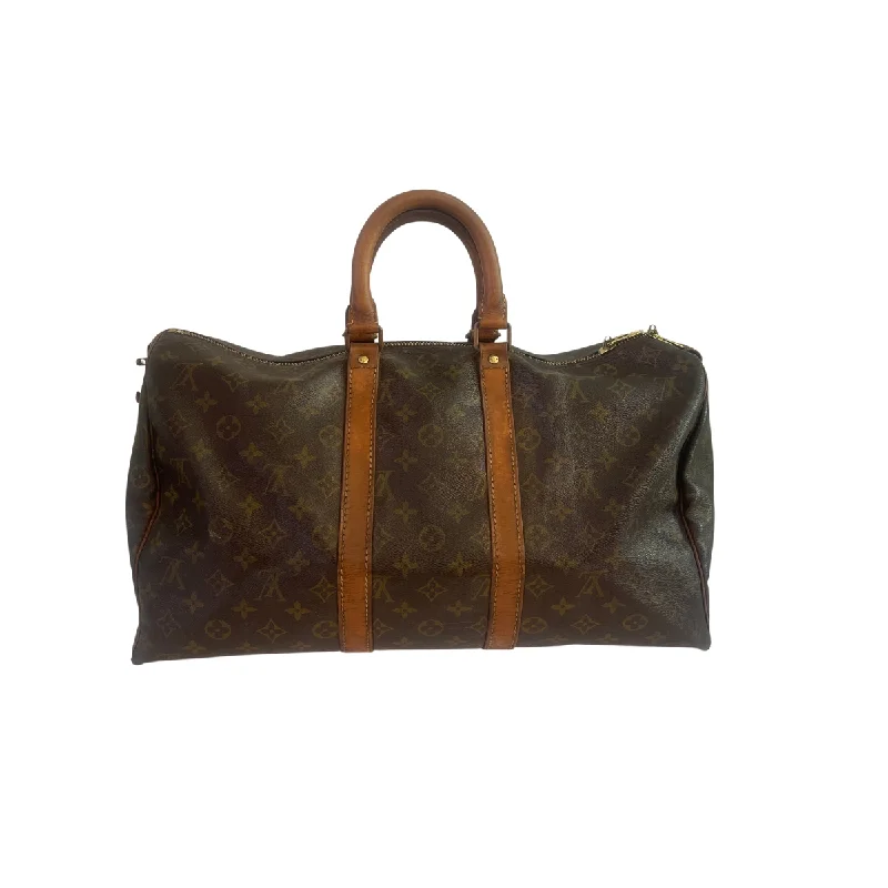 Ladies Louis Vuitton Petite Malle bags with a star - shaped charm for cutenessLouis Vuitton Keepall 50 Monogram Canvas