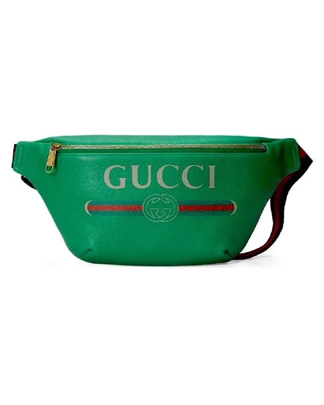 Women Gucci crossbody bags in a bold red colorGUCCI GG LOGO GRAINED CALFSKIN LEATHER BELT BAG