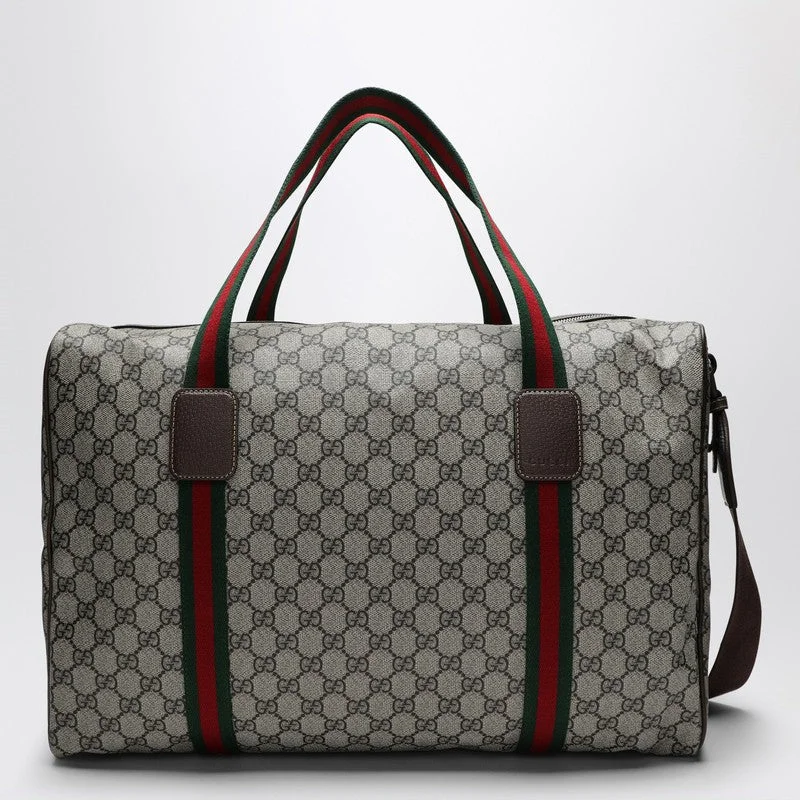 Women Gucci bags with a snap - button closure and a decorative charmGucci Medium Duffle Bag With Web Detail In Beige And Ebony Gg Fabric Men